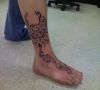 tribal phoenix leg tattoo